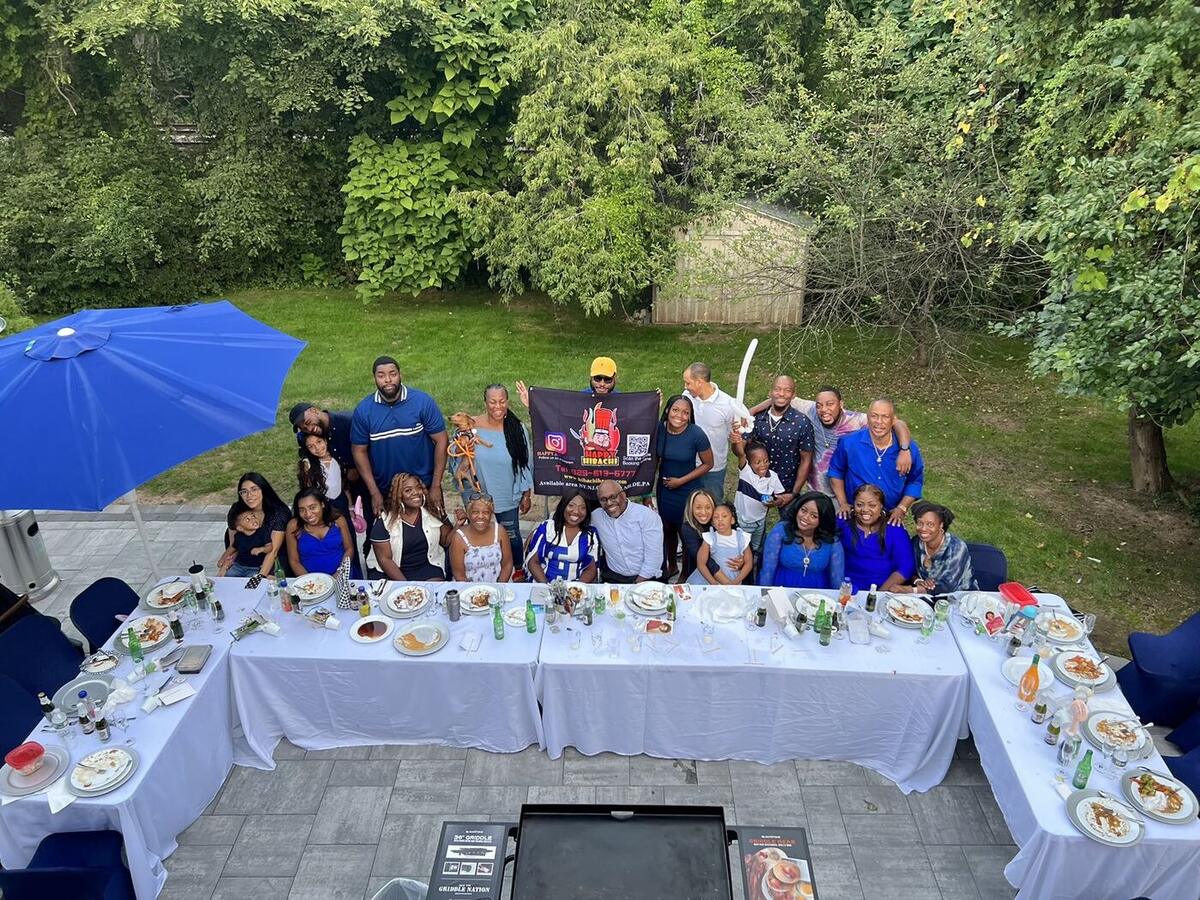 Happy Hibachi chef performing a hibachi show at a Connecticut party