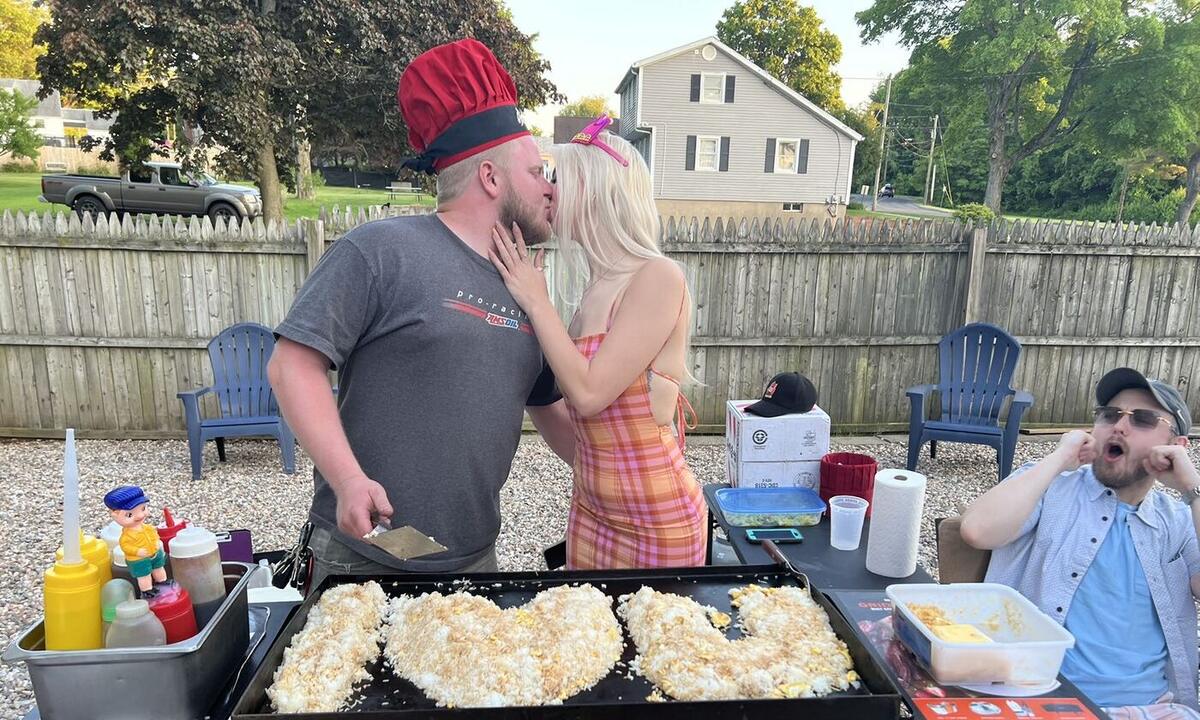 Guests celebrating beside hibachi fried rice on the grill at a Connecticut backyard party
