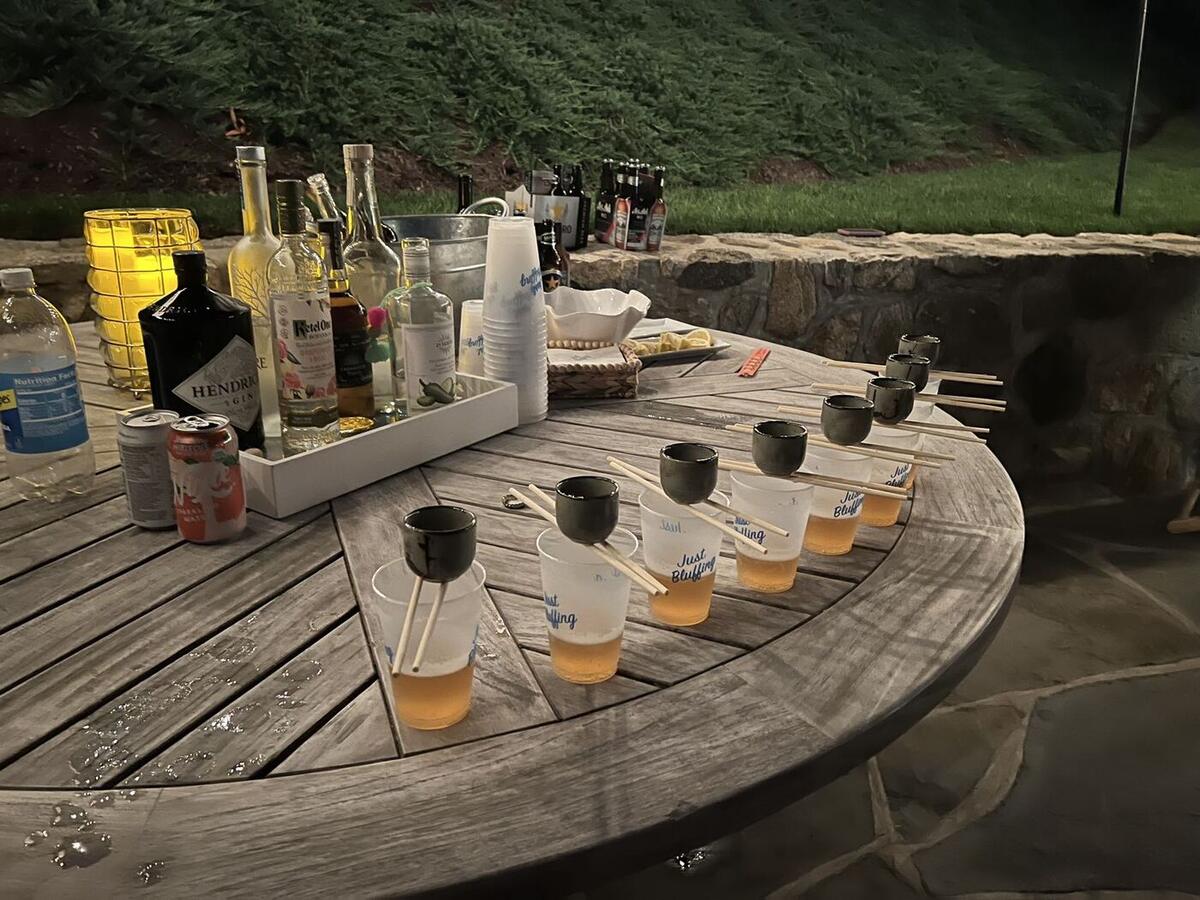 Guests enjoying a sake toast at a Happy Hibachi party in Connecticut
